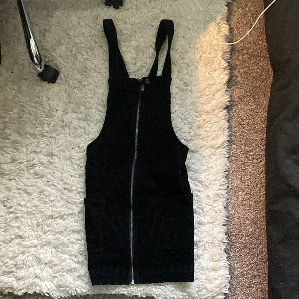 A black good condition skirt romper.